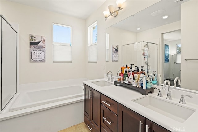 full bath featuring a shower stall, a bath, double vanity, tile patterned floors, and recessed lighting