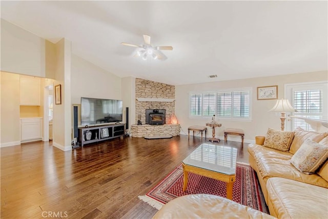 4428 Trumbo Ct, Phelan, CA 92371 - living room with ceiling fan, vaulted ceiling, plenty of natural light, wood finished floors, and a fireplace