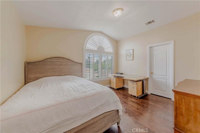 4428 Trumbo Ct, Phelan, CA 92371 - bedroom with lofted ceiling and dark wood-style floors