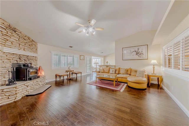 4428 Trumbo Ct, Phelan, CA 92371 - living area with ceiling fan, a wood stove, lofted ceiling, baseboards, and wood finished floors