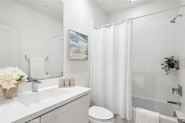 bathroom with toilet, shower / bathtub combination with curtain, and vanity