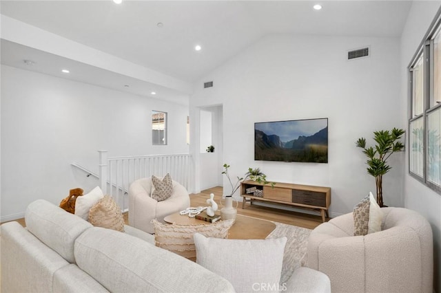 living area featuring recessed lighting, wood finished floors, and vaulted ceiling