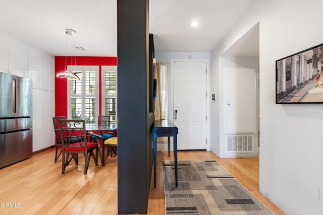 1524 Seabridge Ln, Oxnard, CA 93035 - dining area featuring light wood finished floors and a chandelier