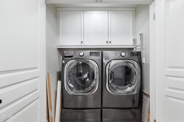 1524 Seabridge Ln, Oxnard, CA 93035 - laundry area featuring washer and clothes dryer and cabinet space