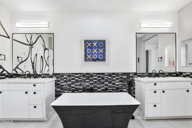 1524 Seabridge Ln, Oxnard, CA 93035 - full bath featuring two vanities, tile walls, a freestanding bath, and tile patterned floors
