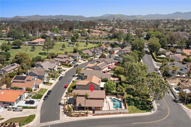 aerial perspective of suburban area featuring a mountainous background