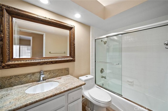 full bath with toilet, vanity, combined bath / shower with glass door, and recessed lighting
