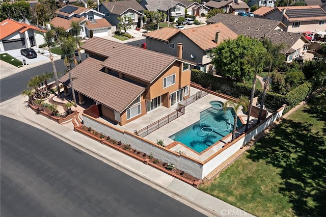 aerial perspective of suburban area with a pool area