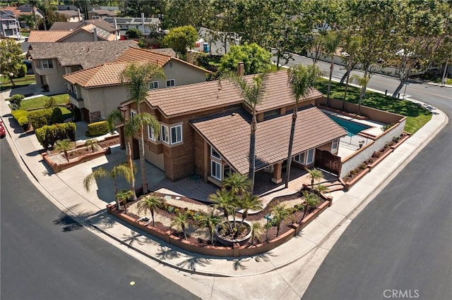 aerial perspective of suburban area featuring a pool