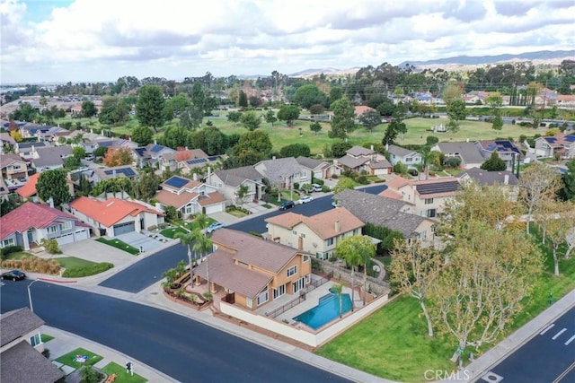 aerial perspective of suburban area featuring a pool
