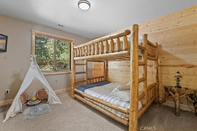 1020 Heritage Trl, Big Bear City, CA 92314 - bedroom with carpet floors, baseboards, and wooden walls
