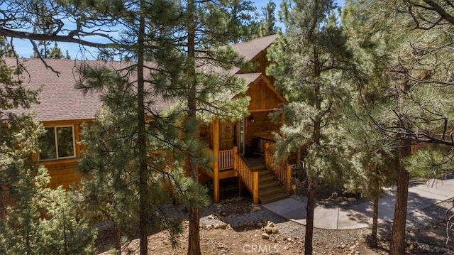1020 Heritage Trl, Big Bear City, CA 92314 - back of house featuring a shingled roof