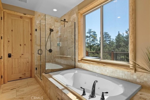 1020 Heritage Trl, Big Bear City, CA 92314 - bathroom with plenty of natural light, a jetted tub, a stall shower, and recessed lighting