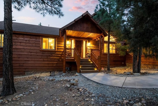 1020 Heritage Trl, Big Bear City, CA 92314 - chalet / cabin with roof with shingles and a porch