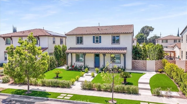 mediterranean / spanish-style house with a porch and stucco siding