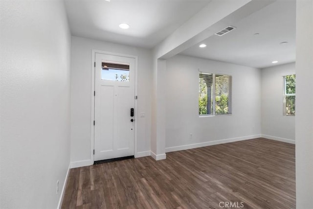 entrance foyer with plenty of natural light, dark wood-type flooring, baseboards, and recessed lighting