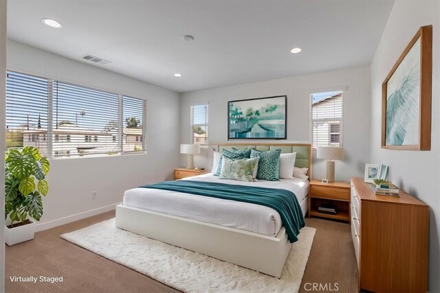 carpeted bedroom with recessed lighting and baseboards