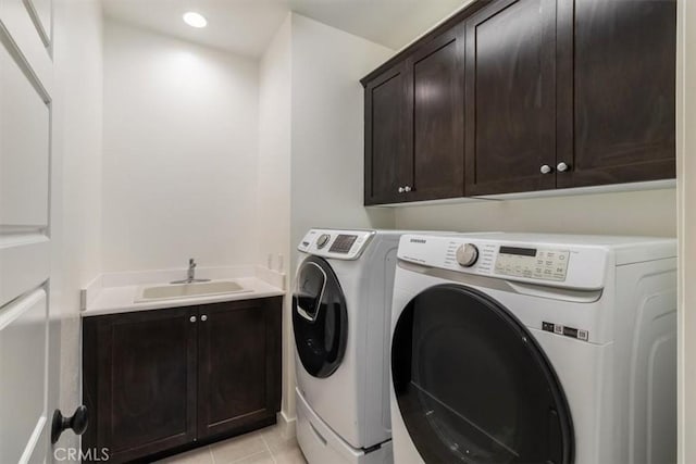 washroom with cabinet space, separate washer and dryer, light tile patterned floors, and recessed lighting