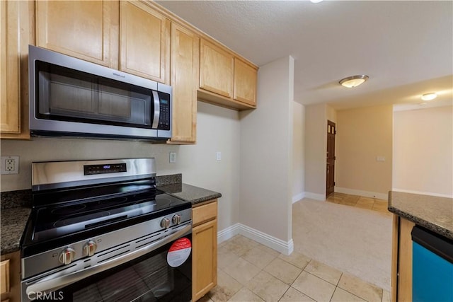 2400 Del Mar Way, Corona, CA 92882 - kitchen with stainless steel appliances, light brown cabinets, light tile patterned floors, light carpet, and dark stone counters