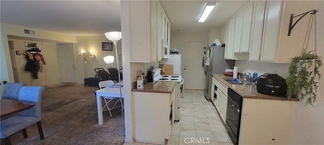 5400 Lindley Ave Unit 116, Encino, CA 91316 - kitchen featuring white appliances, white cabinets, a sink, open floor plan, and dark countertops