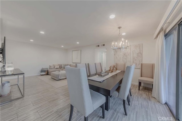 13624 La Jolla Cir Unit D, La Mirada, CA 90638 - dining space with a chandelier, baseboards, recessed lighting, and light wood-type flooring