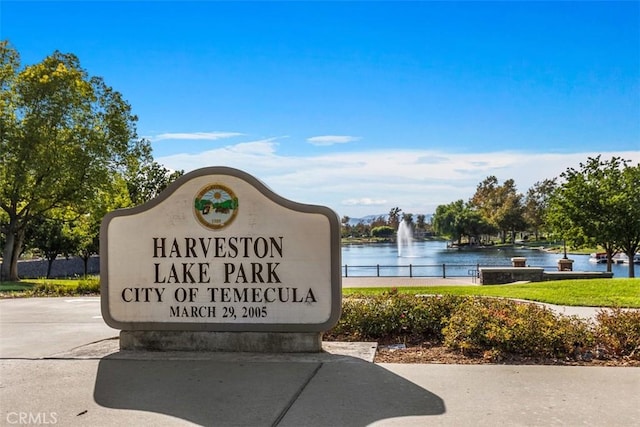 community sign with a water view