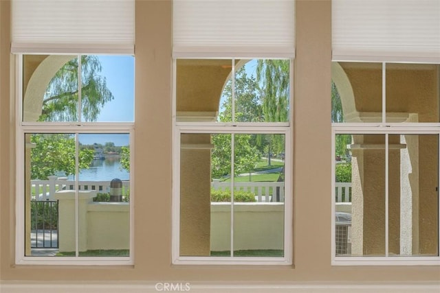 doorway to outside featuring a water view