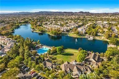 aerial perspective of suburban area with a water and mountain view