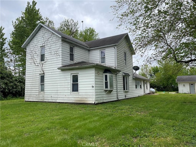 12409 Stamper Rd, Girard, IL 62640 - back of property featuring a yard and a shingled roof