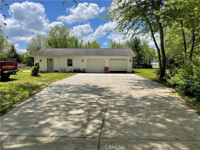 12409 Stamper Rd, Girard, IL 62640 - view of front facade with concrete driveway, an attached garage, and a front lawn
