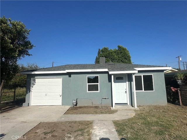 1657 N J St, San Bernardino, CA 92411 - single story home featuring stucco siding, concrete driveway, roof with shingles, and a garage