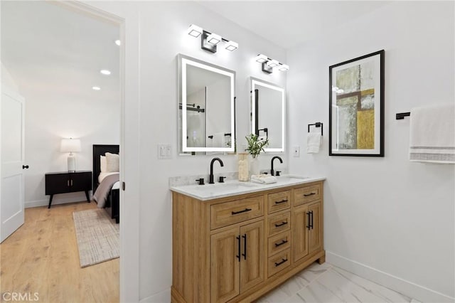 25082 Ericson Way, Laguna Hills, CA 92653 - full bath with baseboards, double vanity, and ensuite bathroom