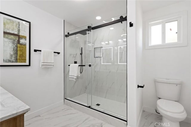 25082 Ericson Way, Laguna Hills, CA 92653 - bathroom with marble finish floors, baseboards, toilet, vanity, and a marble finish shower