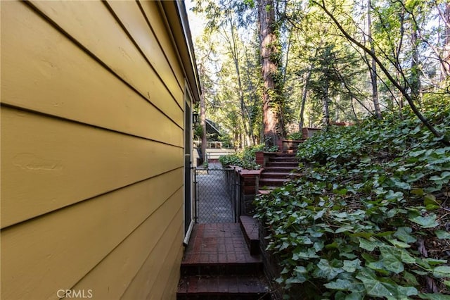 222 Holiday Dr, Lake Arrowhead, CA 92352 - view of home's exterior featuring stairs and a gate