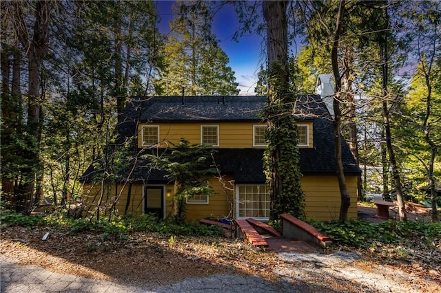 222 Holiday Dr, Lake Arrowhead, CA 92352 - view of front of house featuring roof with shingles and a chimney