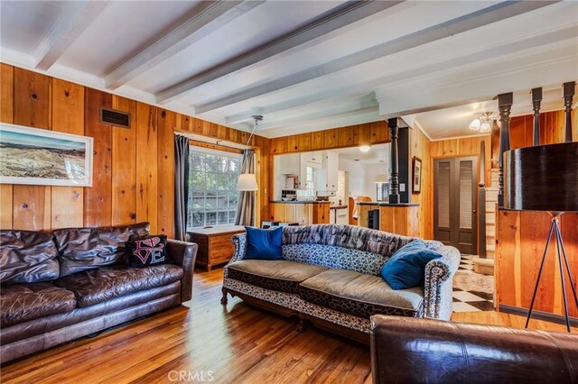 222 Holiday Dr, Lake Arrowhead, CA 92352 - living area with beam ceiling, wooden walls, and wood finished floors