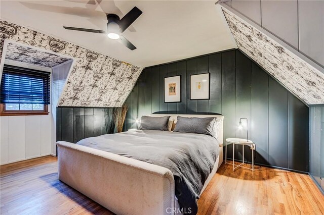 222 Holiday Dr, Lake Arrowhead, CA 92352 - bedroom featuring wood finished floors, a decorative wall, and ceiling fan