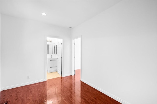 507 S Gaybar Ave, West Covina, CA 91790 - unfurnished bedroom with wood finished floors, baseboards, and recessed lighting