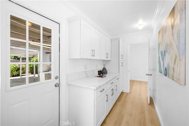 507 S Gaybar Ave, West Covina, CA 91790 - hall with light wood-style flooring, crown molding, and baseboards