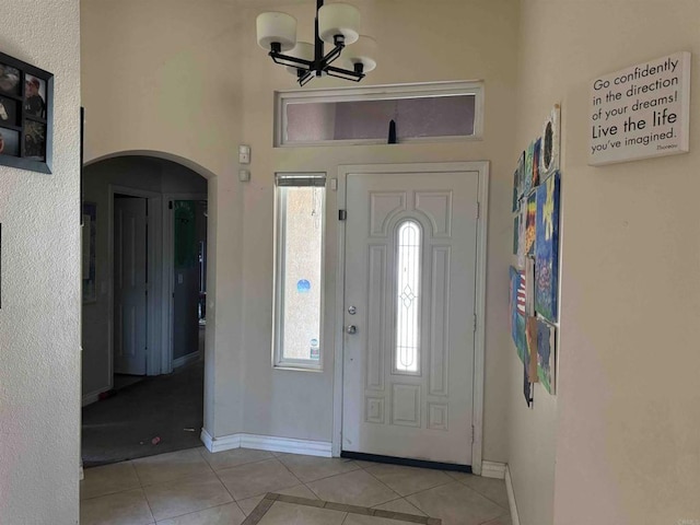 1255 Duckweed Trl, Campo, CA 91906 - tiled entryway featuring baseboards, a chandelier, arched walkways, and healthy amount of natural light