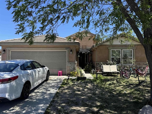 1255 Duckweed Trl, Campo, CA 91906 - view of front of property featuring stucco siding, an attached garage, driveway, and stone siding