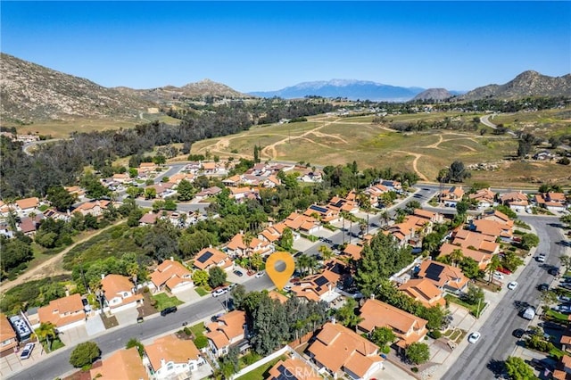 9656 Pebble Brook Dr, Moreno Valley, CA 92557 - aerial overview of property's location with mountains and nearby suburban area