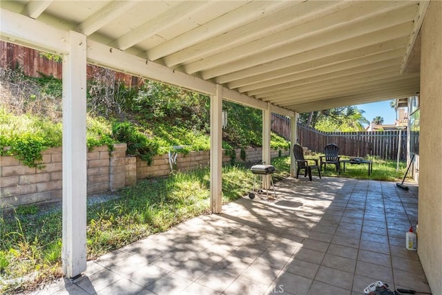 9656 Pebble Brook Dr, Moreno Valley, CA 92557 - view of patio featuring a fenced backyard and a grill