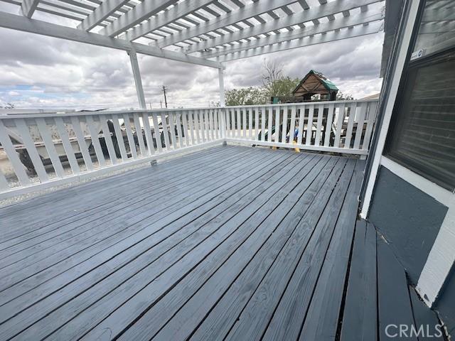 wooden deck with a pergola