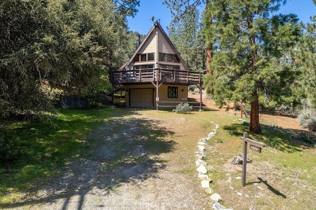 15616 San Moritz Dr, Pine Mountain Club, CA 93222 - view of front facade with driveway, a deck, and a garage