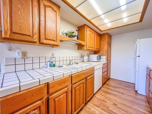 15616 San Moritz Dr, Pine Mountain Club, CA 93222 - kitchen featuring white appliances, a sink, light wood-style flooring, and tile counters