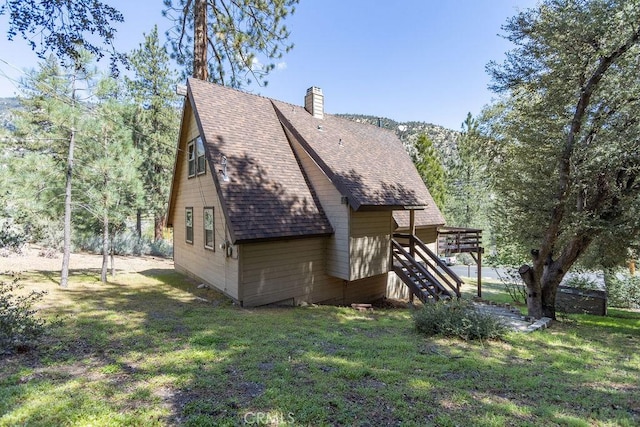 15616 San Moritz Dr, Pine Mountain Club, CA 93222 - back of property with stairway, roof with shingles, a lawn, and a deck