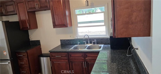 9715 La Docena Ln, Pico Rivera, CA 90660 - kitchen featuring freestanding refrigerator and dark stone countertops