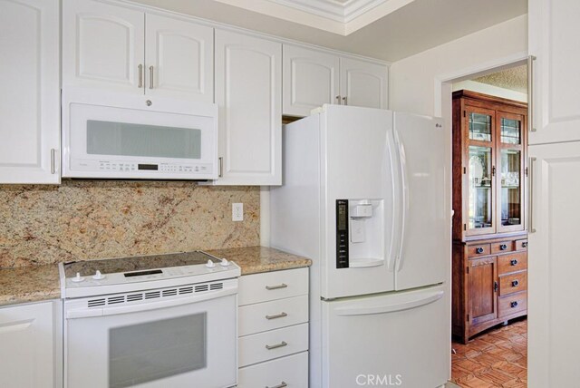 3424 Calle Azul Unit A, Laguna Woods, CA 92637 - kitchen with white appliances, white cabinetry, tasteful backsplash, and light stone countertops