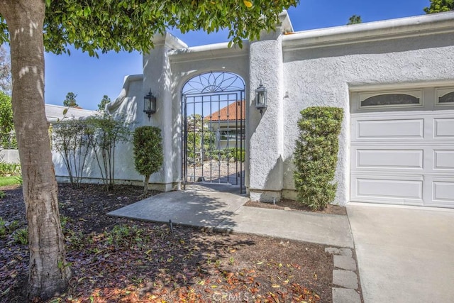 3424 Calle Azul Unit A, Laguna Woods, CA 92637 - entrance to property with a gate and stucco siding